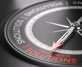 3D illustration of a compass over black background with the text tailored solutions written in red. Made-to-measure services concept.